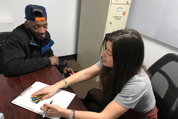 Earl meeting with Amanda Kaim at the Criminal Justice Agency’s Long Island City Office.